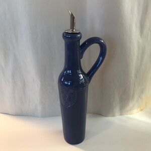 A beautiful olive oil dispenser.